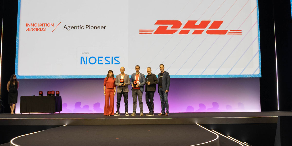 Noesis and DHL representatives receiving the Agentic Pioneer award at the OutSystems ONE Conference Innovation Awards