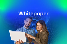 Professionals reviewing information on a laptop, highlighting a whitepaper