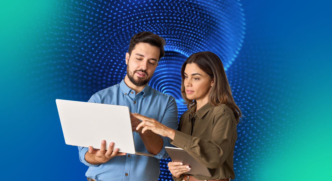Two professionals working on a laptop with an abstract digital background