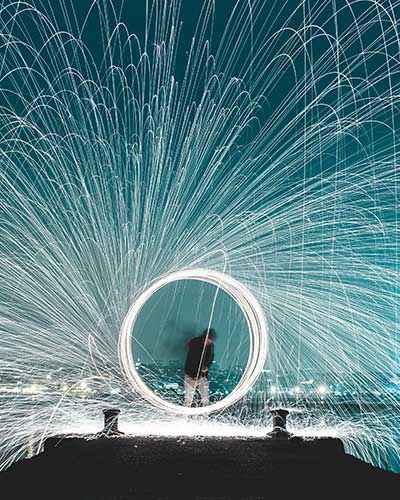 Person with light beam represents experience and expertise