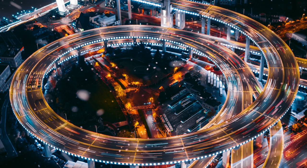 Header Time lapse highway intersection by night, represents our product 4Assets created with IoT technology