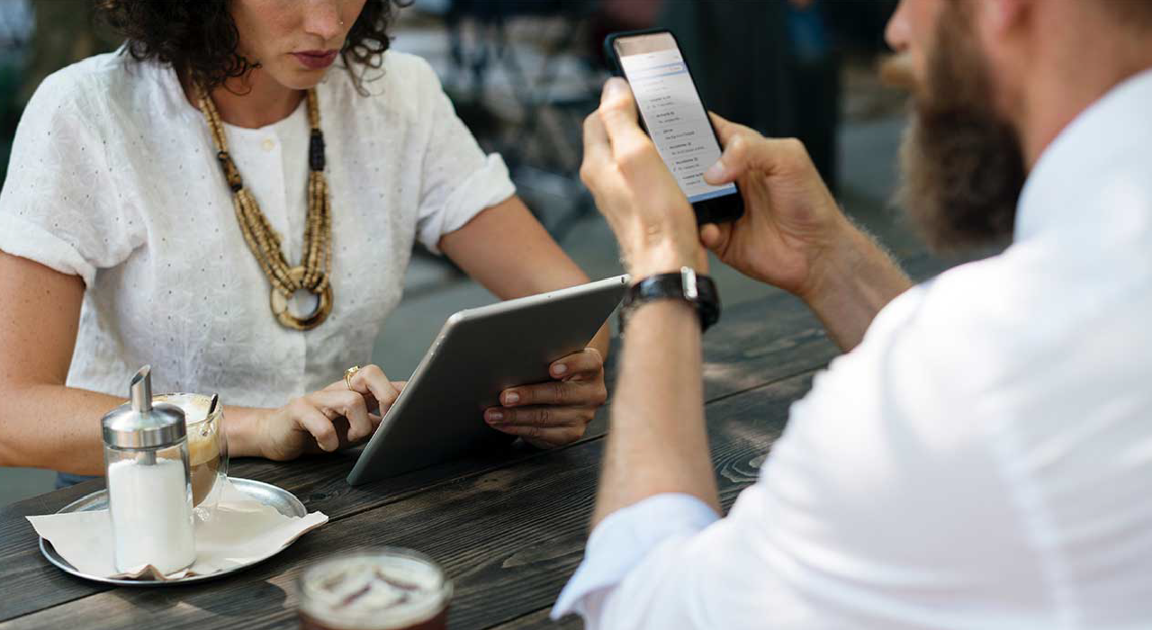 Header, people work at coffee shop using mobile devices represents Mobility