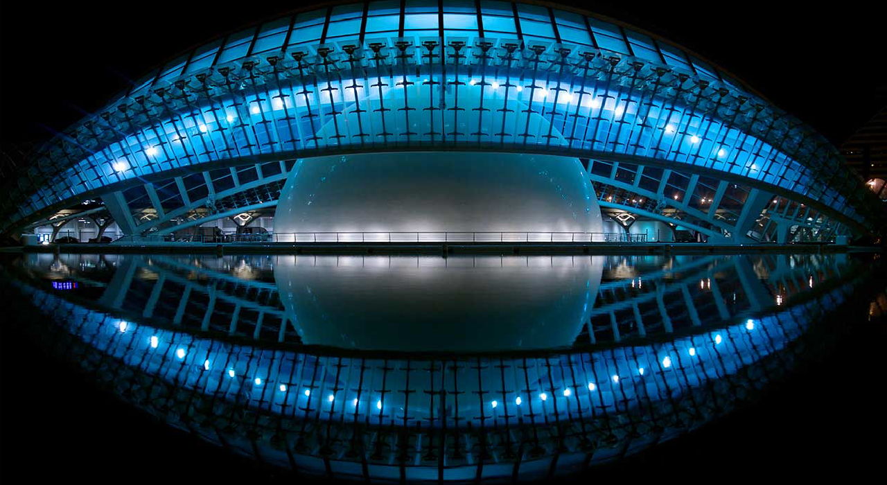 Header, Modern Architecture by night represents the overview of your business with Qlik